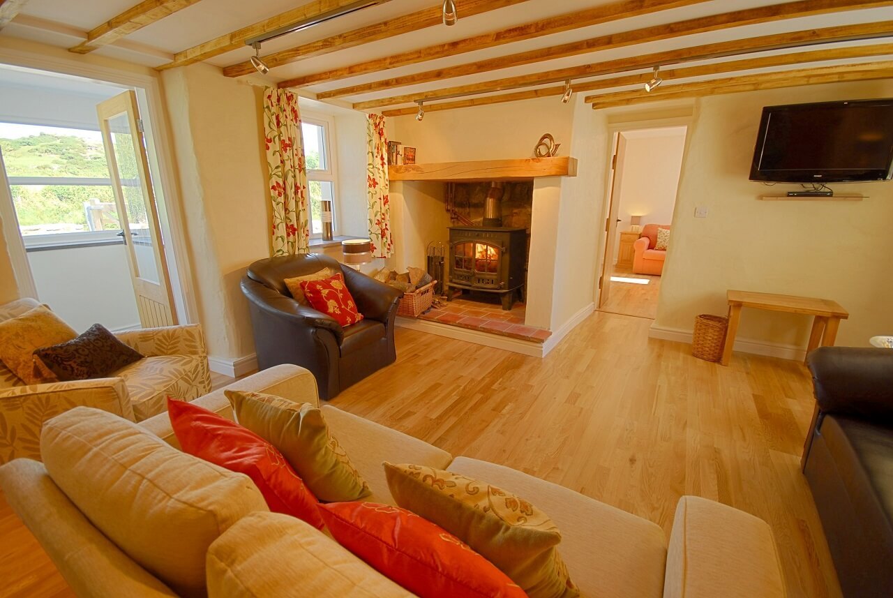 Cosy sitting room with log burner