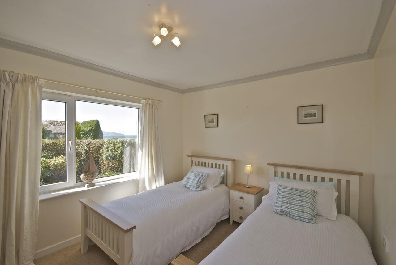 Twin bedroom with sea views