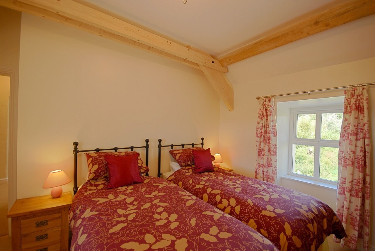 Twin bedroom with beams sea view